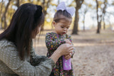 K12CNSIPPY-UN-T-SIPPY-ROBINSON-Girl Preparing To Sip From Bottle_medium