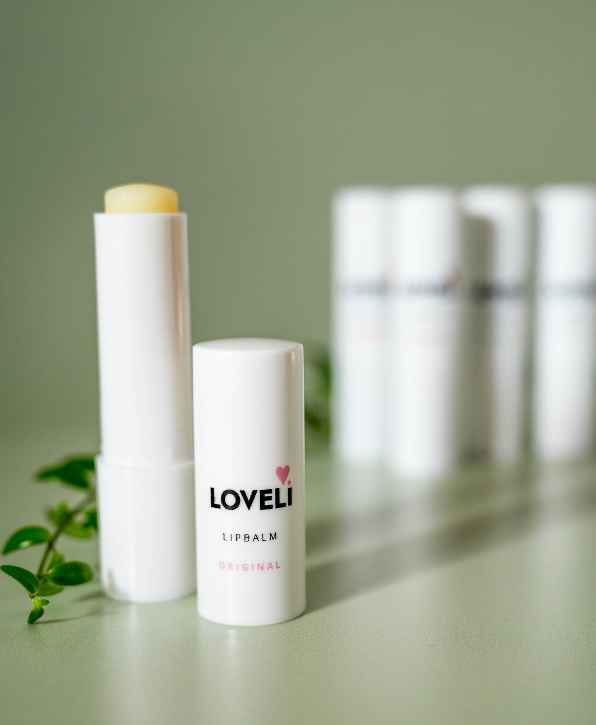 Loveli-lipbalm-original-green-backgr